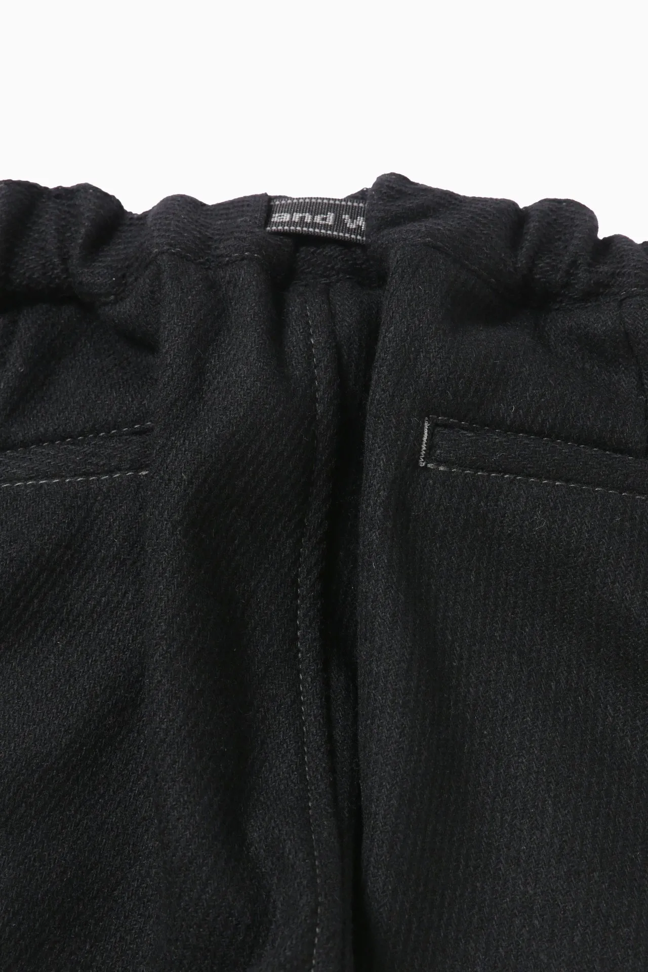 and wander - REWOOL Tweed Tapered Pants - Black